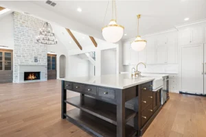 Sabinas-Creek-Kitchen-Island-with-Great-Room Beyond